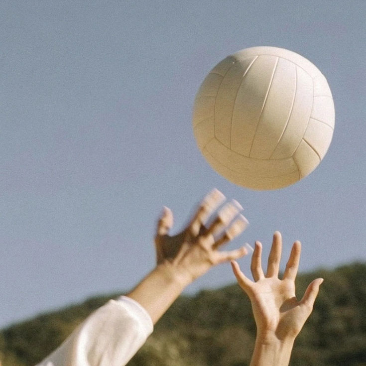 oyoyo — hands reaching for a volleyball